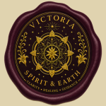 A circular wax-seal logo for “Victoria Spirit & Earth”. The seal features a deep plum-colored wax border surrounding a dark textured medallion adorned with intricate metallic gold artwork